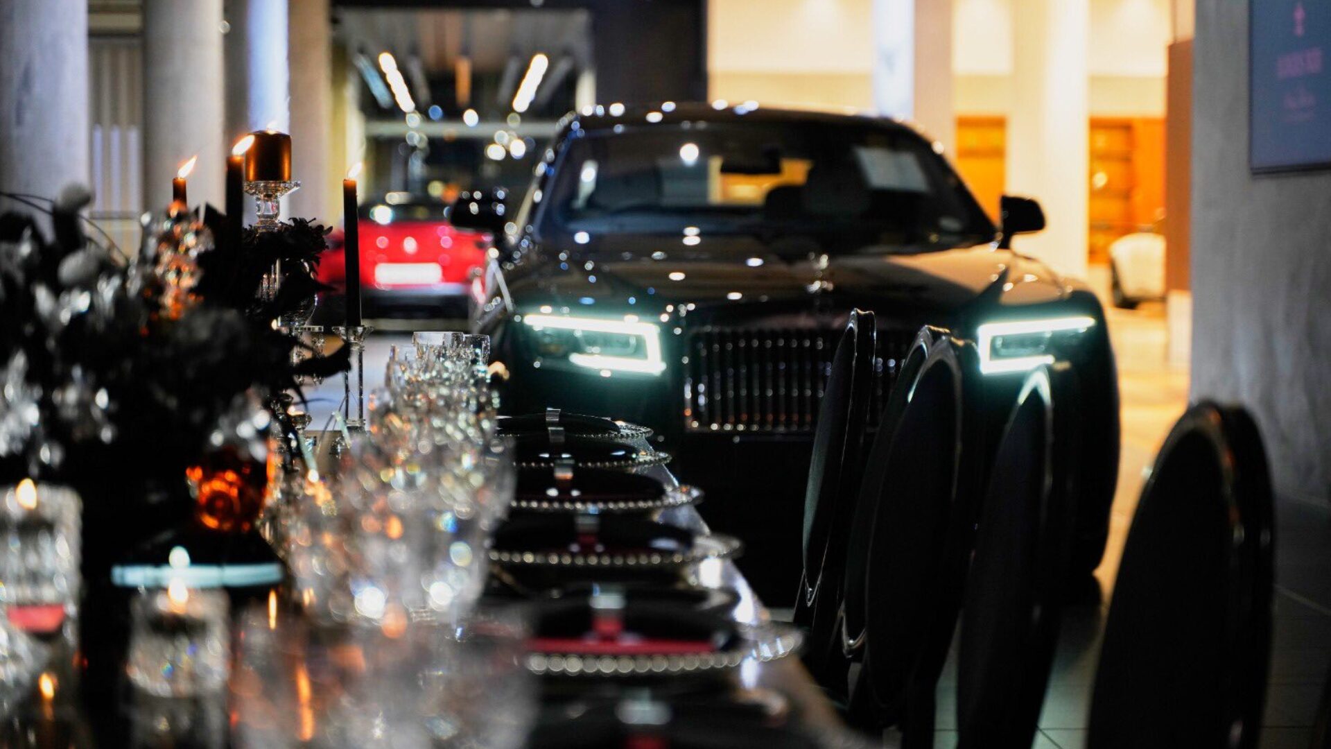 Vehicle reveal at a candlelit product launch dinner